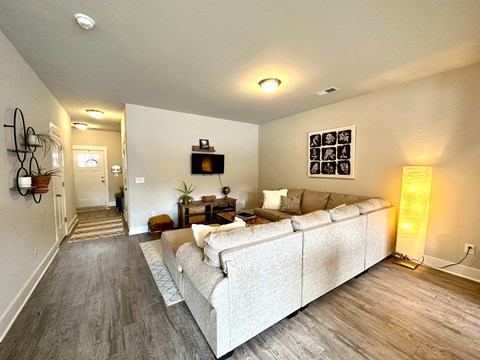 a living room with a couch and a tv