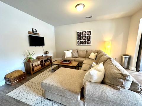 a living room with a couch and a tv
