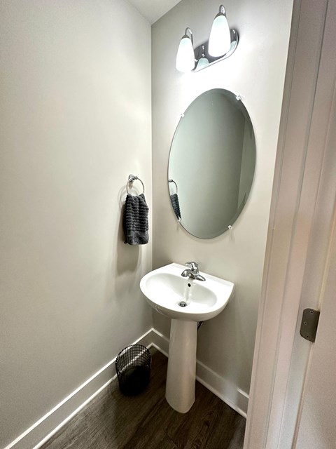 a small bathroom with a sink and a mirror