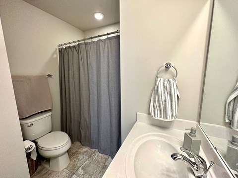 a bathroom with a toilet and a sink
