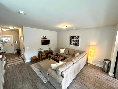 a living room with a couch and a tv