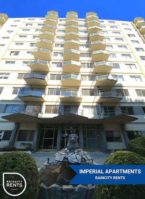 A tall building with balconies and a sign that says "Imperial Apartments".