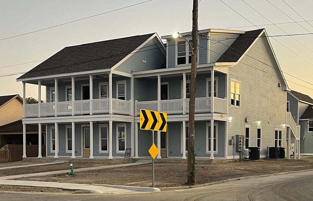 a house with a street sign in front of it