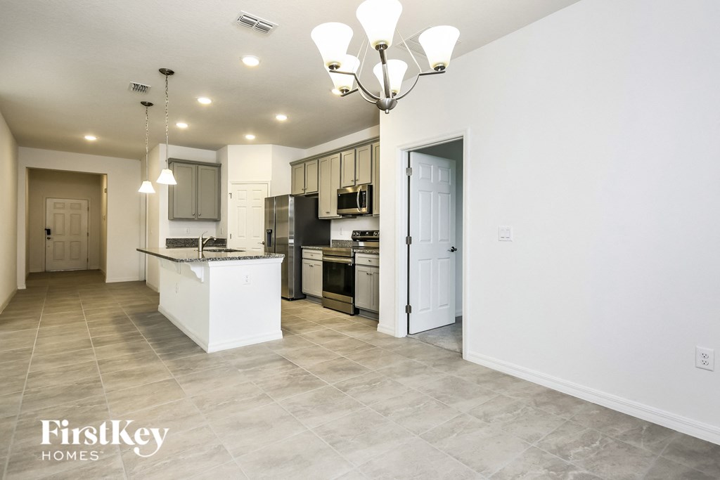 the kitchen and dining room are open to the living room and family room