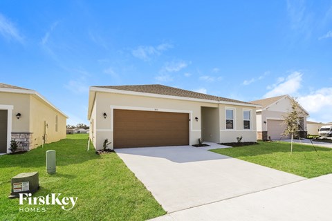 a house with a garage door and a driveway