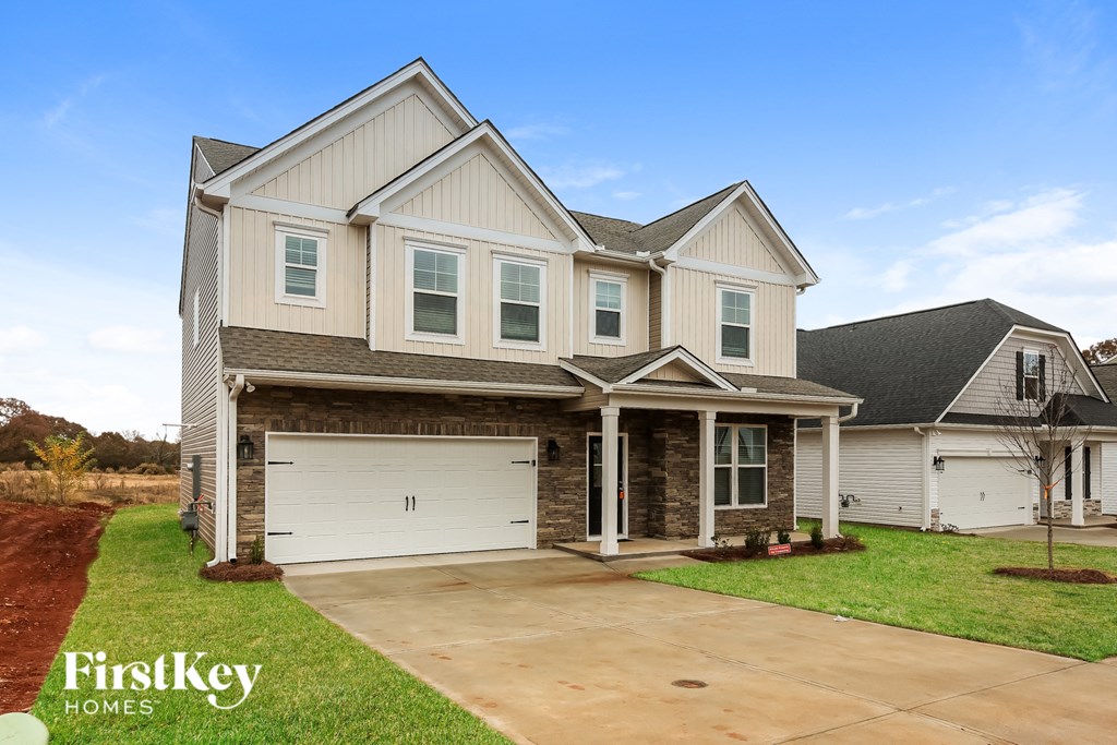 a large house with a garage and a driveway