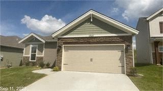 a garage door in front of a house