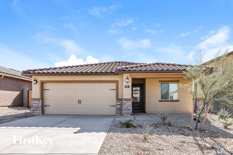 a home with a garage door in front of it