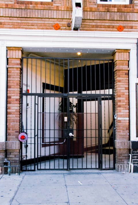 A black gate with a red circle and white line on it.