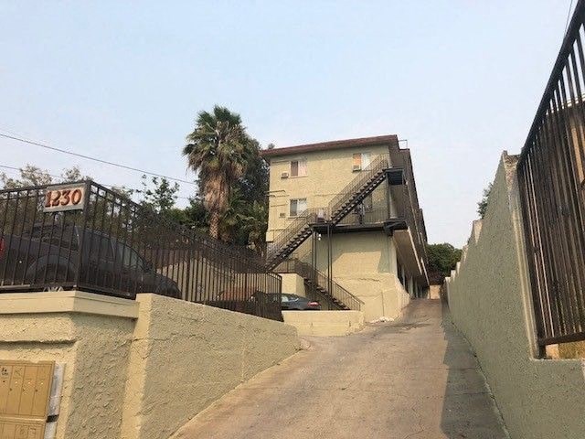 A house numbered 130 with a staircase leading to the front door.