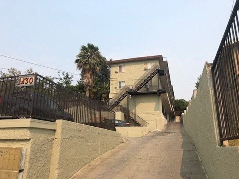 A house numbered 130 with a staircase leading to the front door.