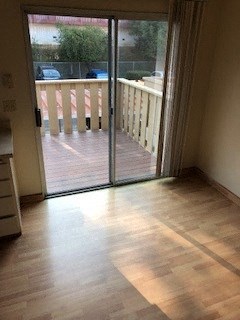 Balcony view from inside home Interior photo of slider in kitchen leading to balcony