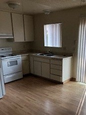 Kitchen photo Kitchen photo showing slider and cabinets