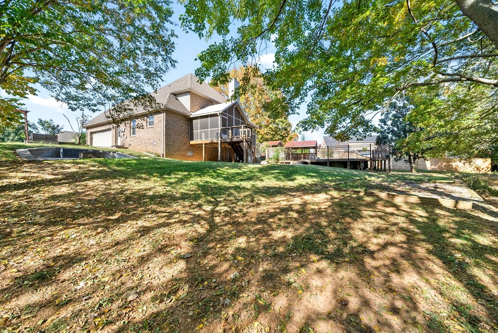 a house on a hill with grass and trees