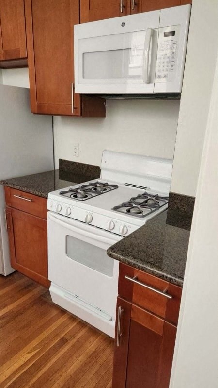 a kitchen with a stove and a microwave