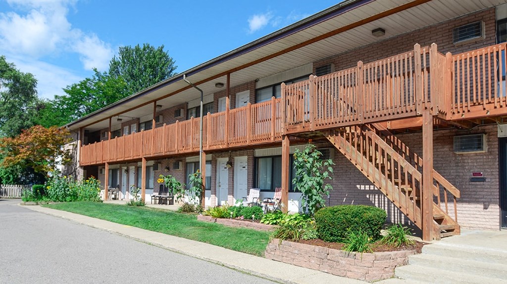 a view of the front of a building with wooden stairs