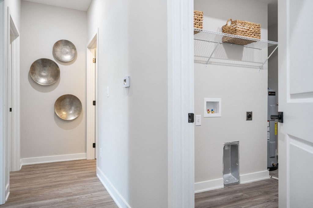 a hallway with a closet and mirrors on the wall