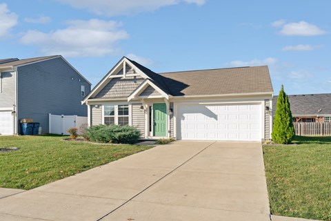 a house with a driveway and a garage door