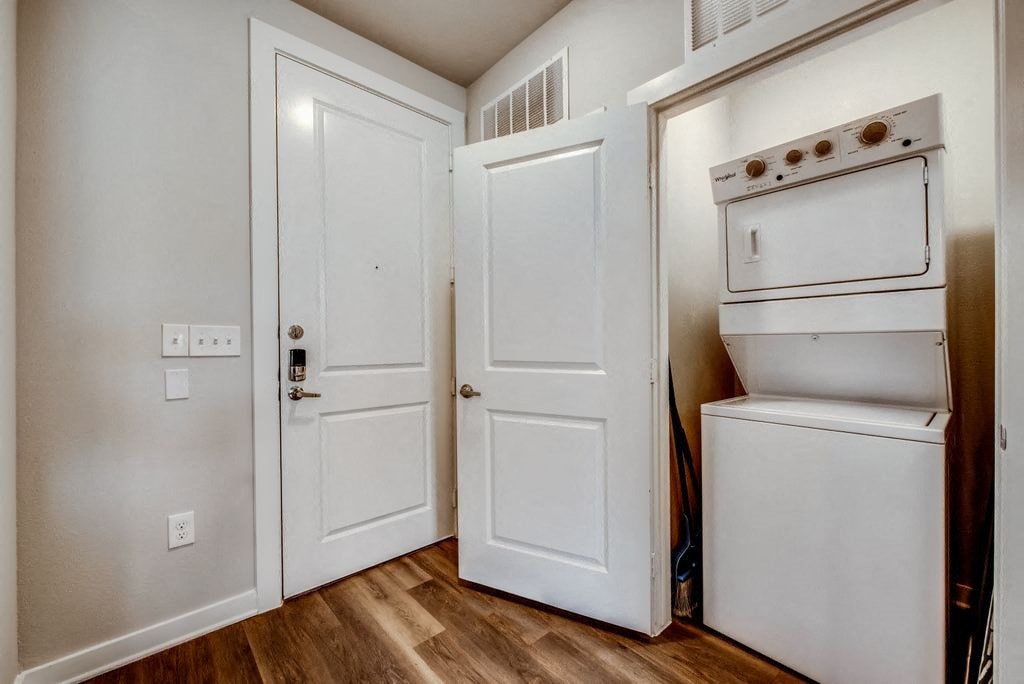 a kitchen with white doors and a stove and a refrigerator