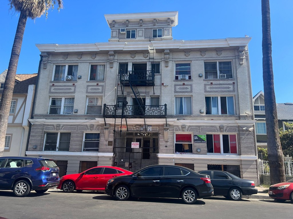 a building with cars parked in front of it