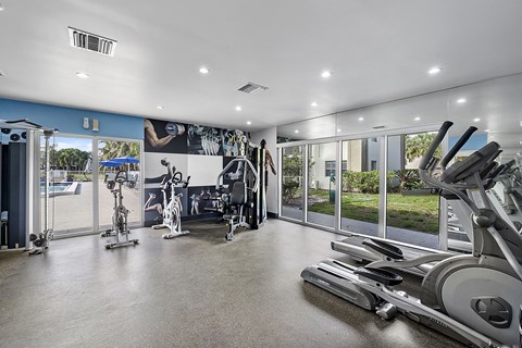 A spacious gym with a variety of exercise equipment.
