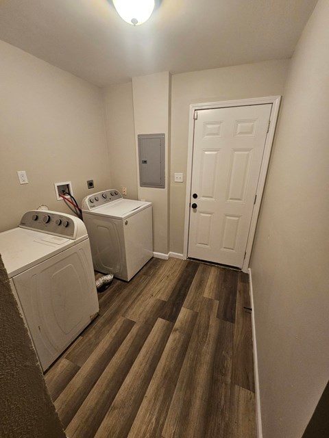 A laundry room with a washer and dryer.