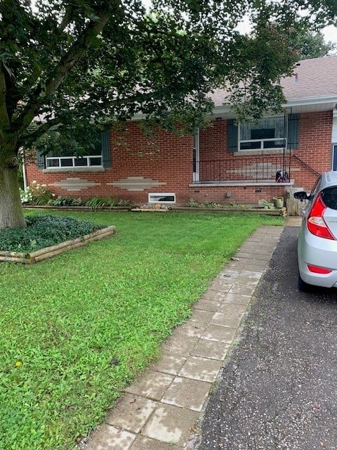 a car parked in a yard in front of a house