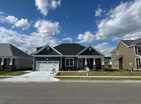 a house with a driveway and a garage door