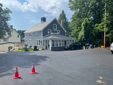 a house with cones in a parking lot