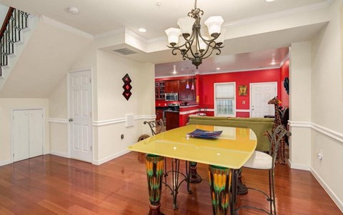 a kitchen and dining room with a yellow table