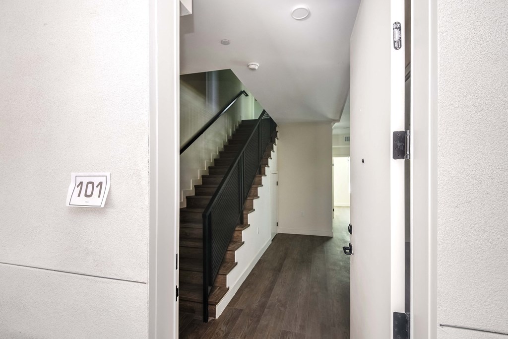 the staircase leading up to the top floor of a house