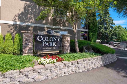 the sign for colony park in front of a building