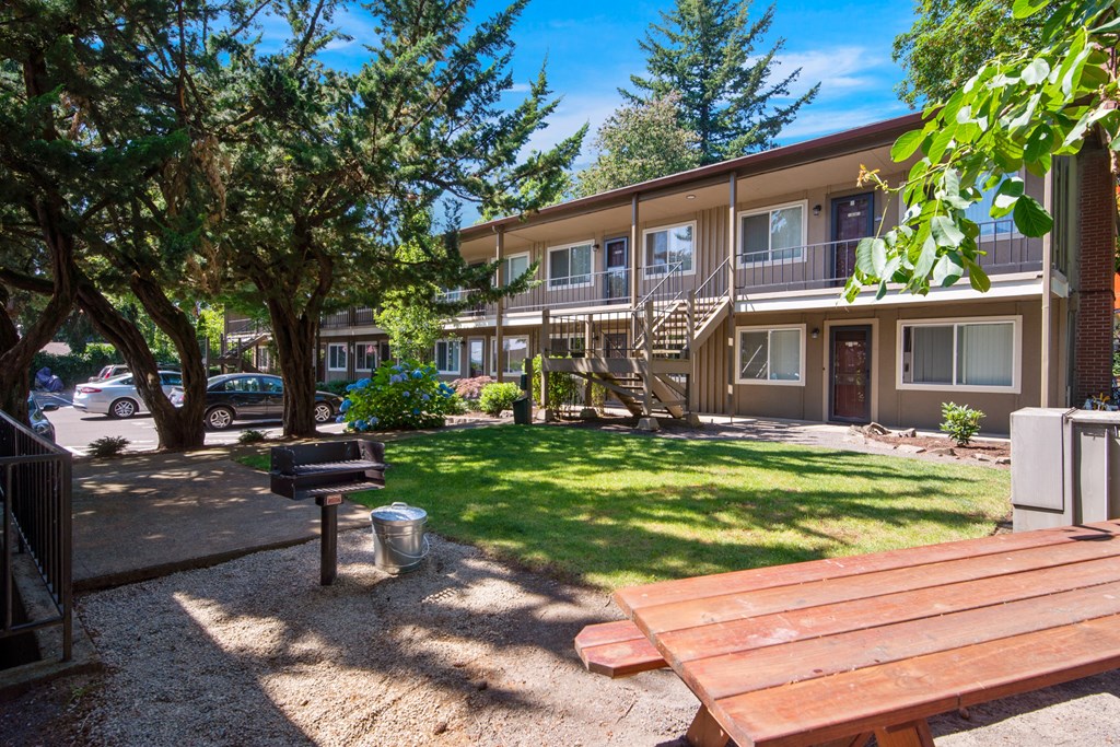our apartments have a spacious yard with a picnic table and a grill