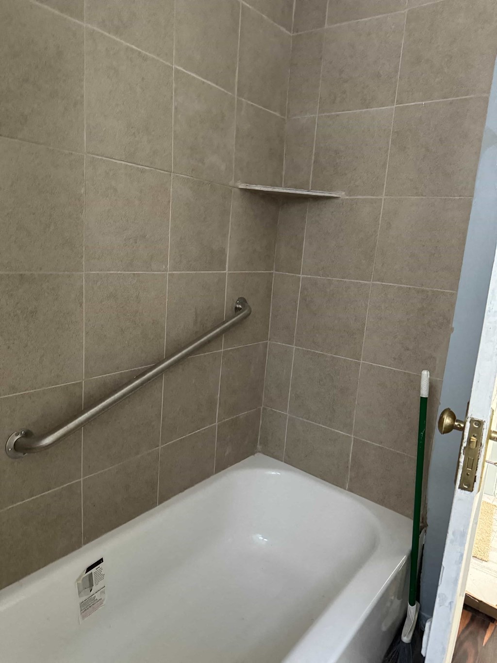 a small bathroom with a shower and a tub