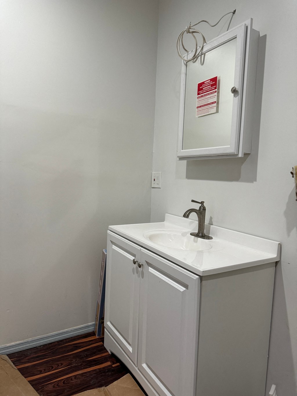 a small bathroom with a sink and a medicine cabinet