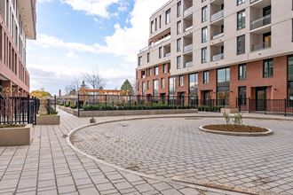 an empty courtyard in front of a building