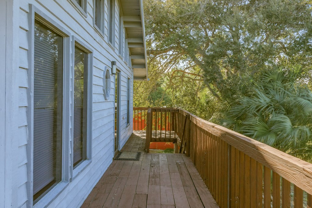 the deck is accessed through the side of the house