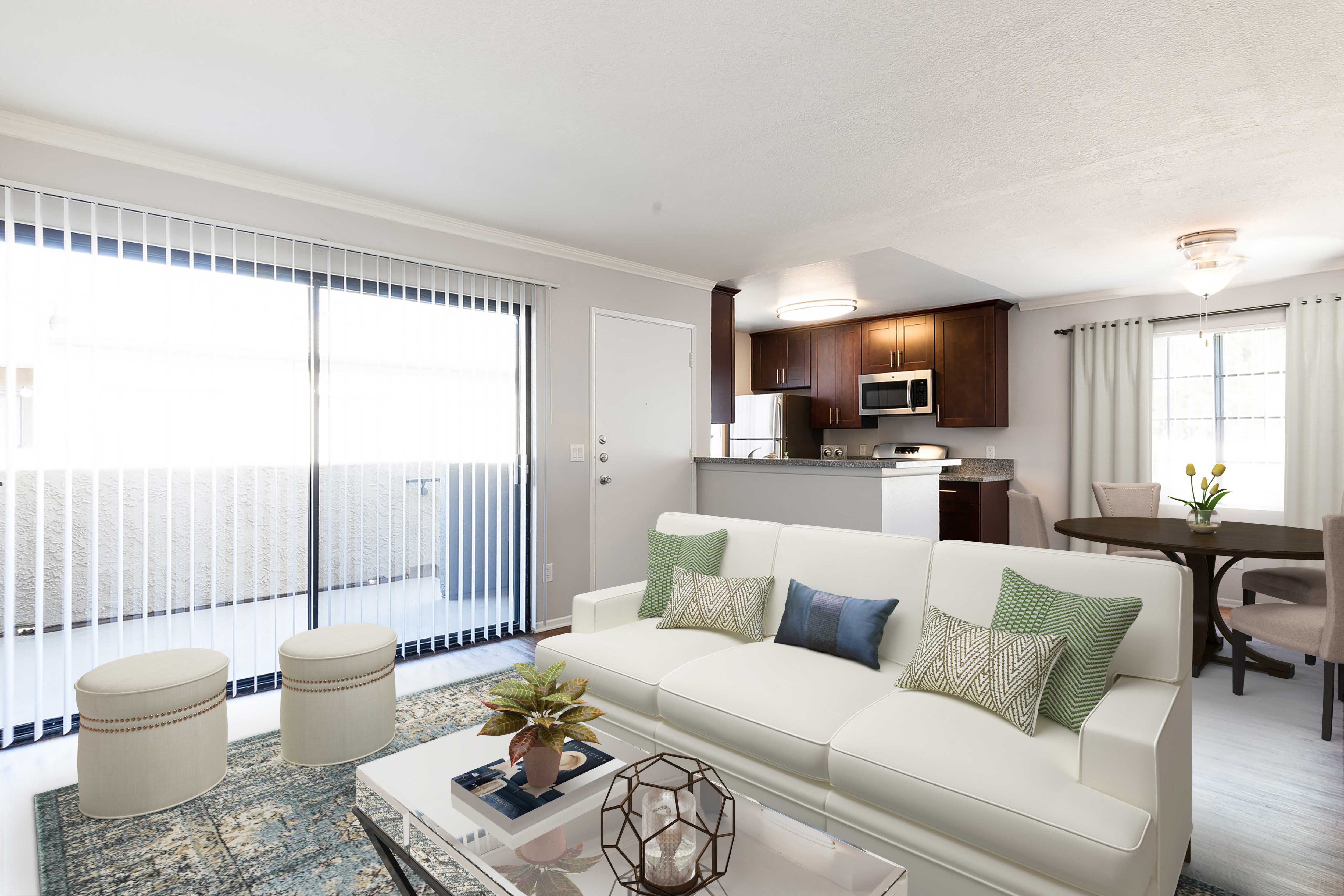 a living room with a white couch and a table