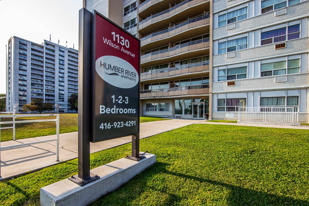 A sign for 1130 Wilson Avenue Humber River with a phone number for bedrooms.