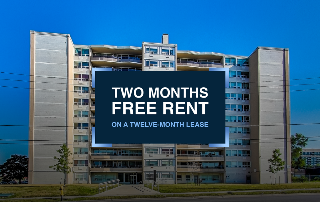 A large building with a sign offering two months free rent on a twelve-month lease.