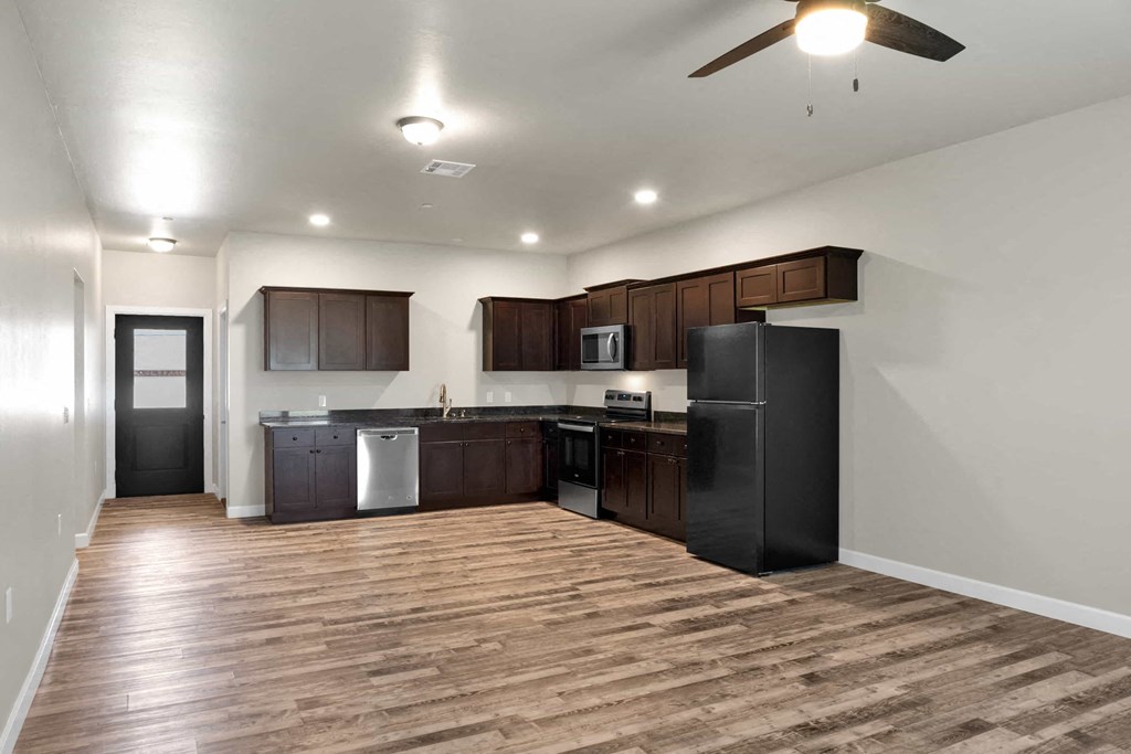 a kitchen with a refrigerator and a sink