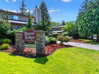 the sign in front of the royal ridge apartments