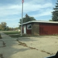 a small building on the side of a road