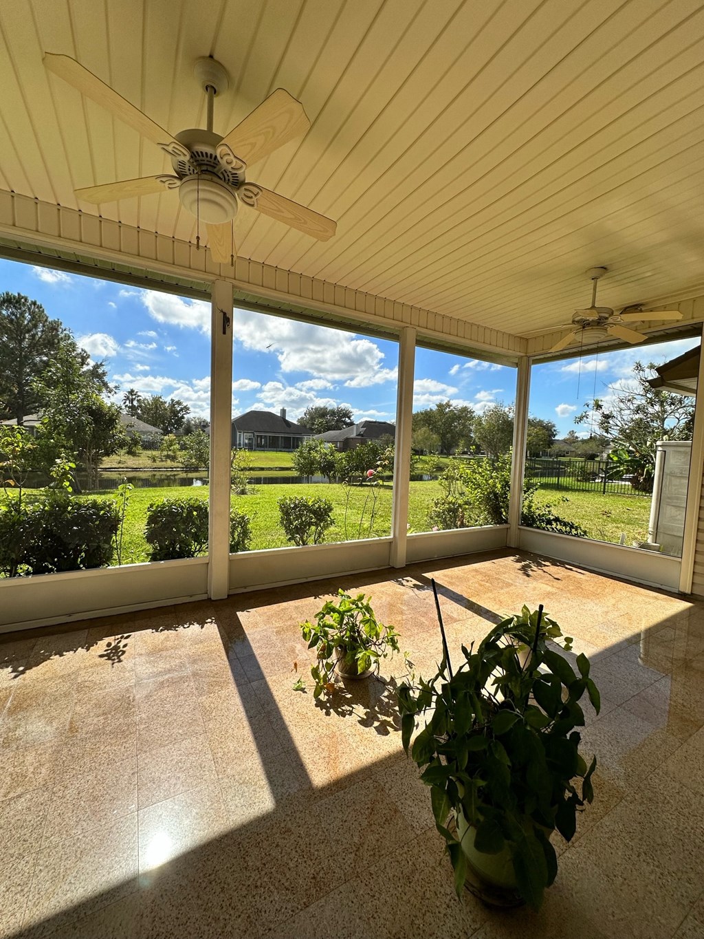 the screened porch has a view of the vineyard and golf course