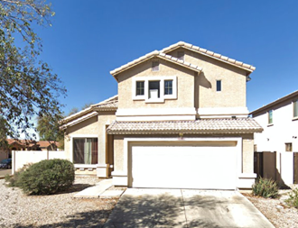 a house with a white garage door in front of it