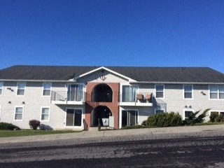 a large house with a street in front of it