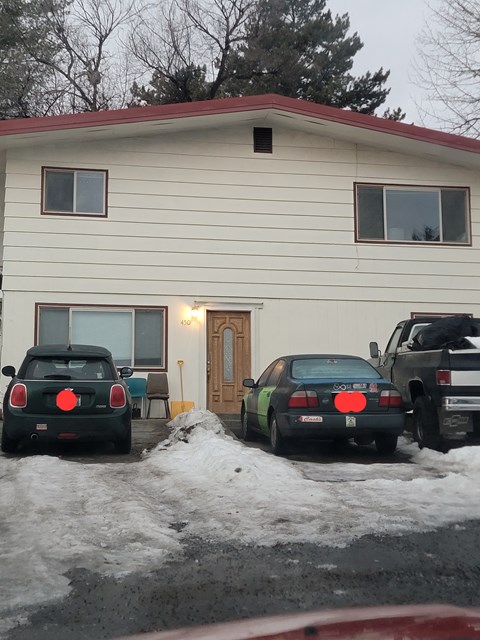 a house with cars parked in front of it