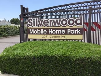 a sign park in front of a gate