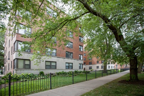 our apartments are located in a quiet neighborhood with trees and a sidewalk