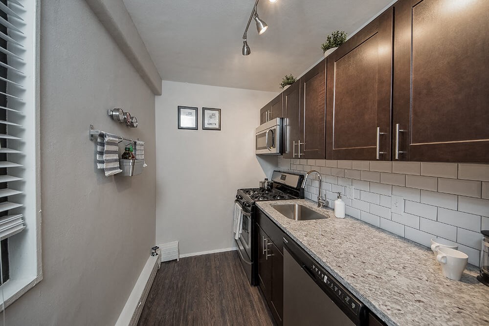 a kitchen with a counter top and a sink